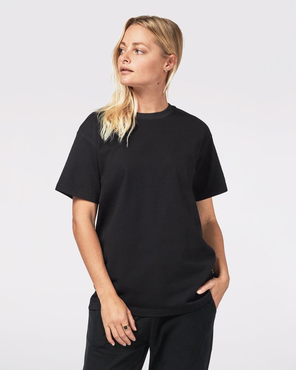 Black women's basic t-shirt made from soft cotton, featuring a relaxed fit and crew neckline.