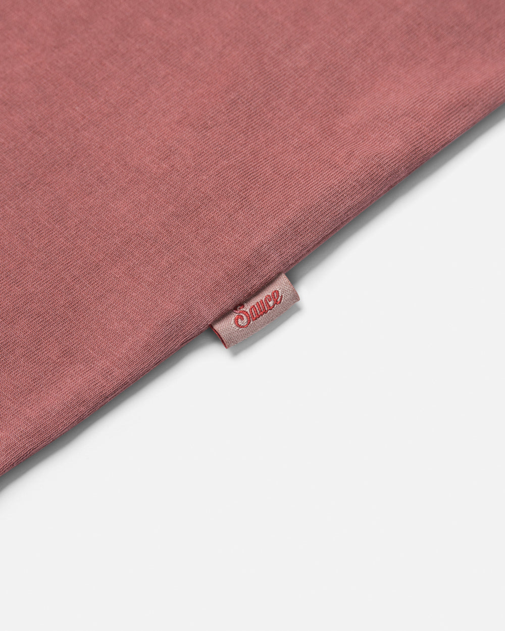 Close up of a label on the side of a t-shirt