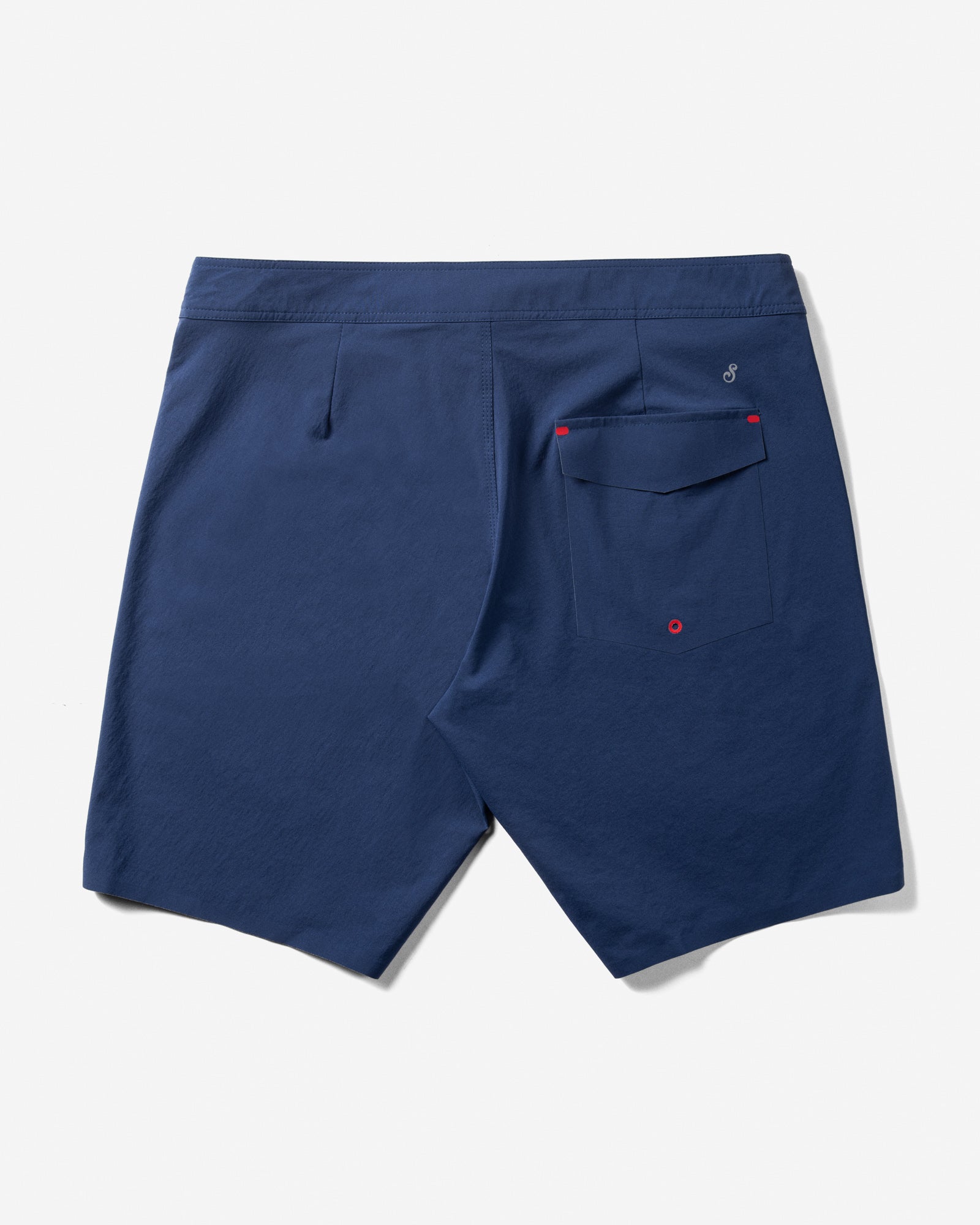Navy blue shorts with red buttons on a white background