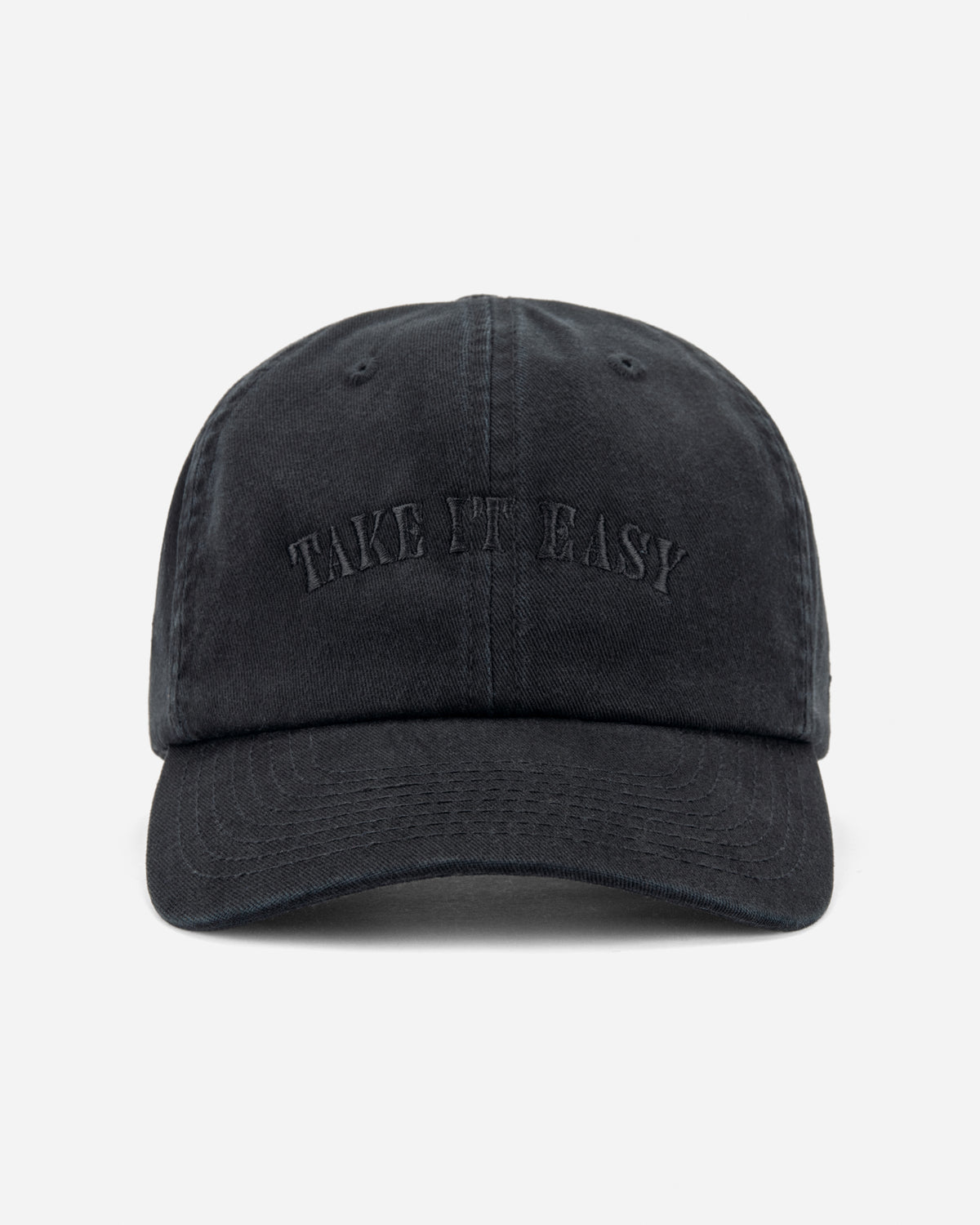 A black washed cotton baseball cap with 'TAKE IT EASY' embroidered in tonal black lettering on the front, set against a plain light gray background.