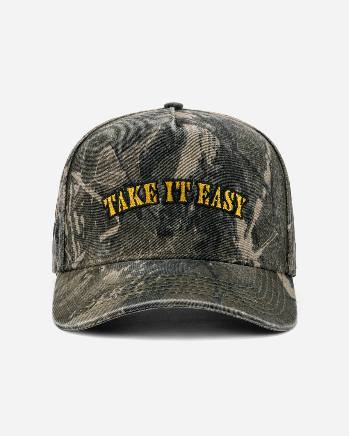 A distressed camouflage baseball cap with 'TAKE IT EASY' embroidered in yellow on the front, set against a plain light gray background.