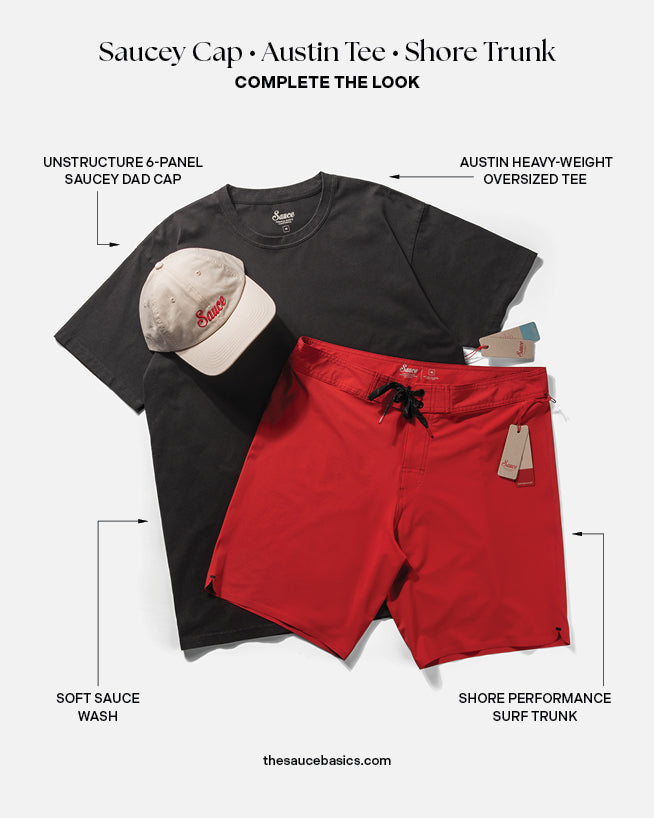 Black t-shirt, red shorts, and beige cap with text labels on a white background