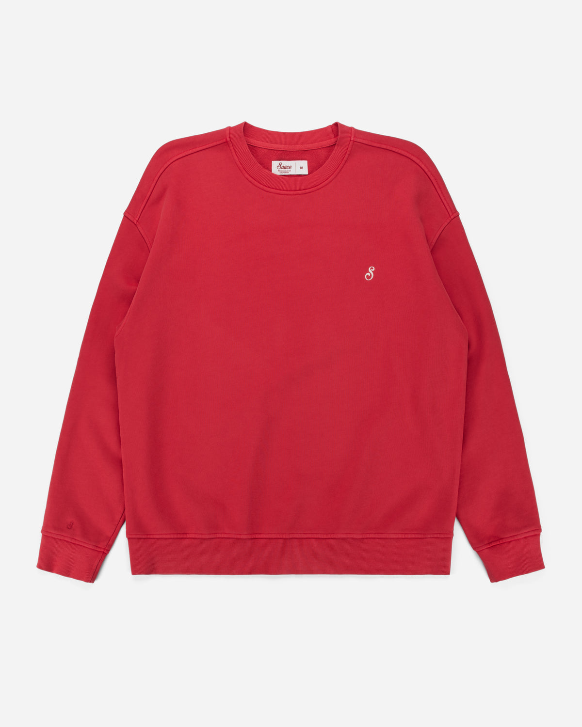 A red crewneck sweatshirt with a small white embroidered logo on the left chest, displayed flat against a light gray background.
